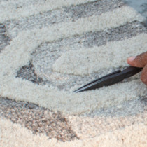 hand carving a rug